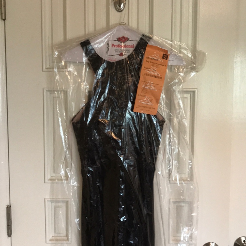 Formal black dress with front slit.